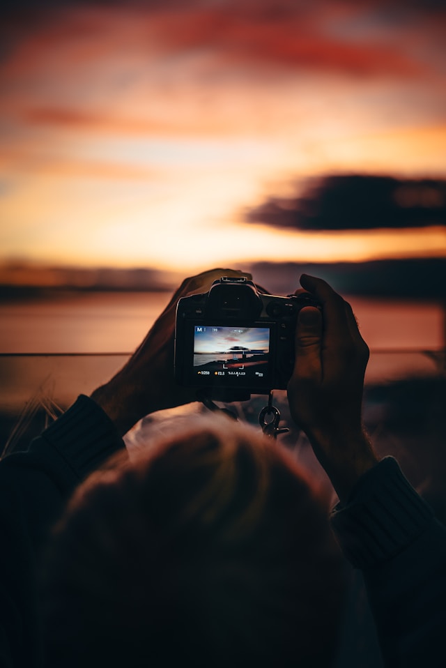 digital camera taking picture of a sunset