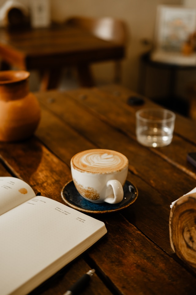 latte and book in a coffeeshop